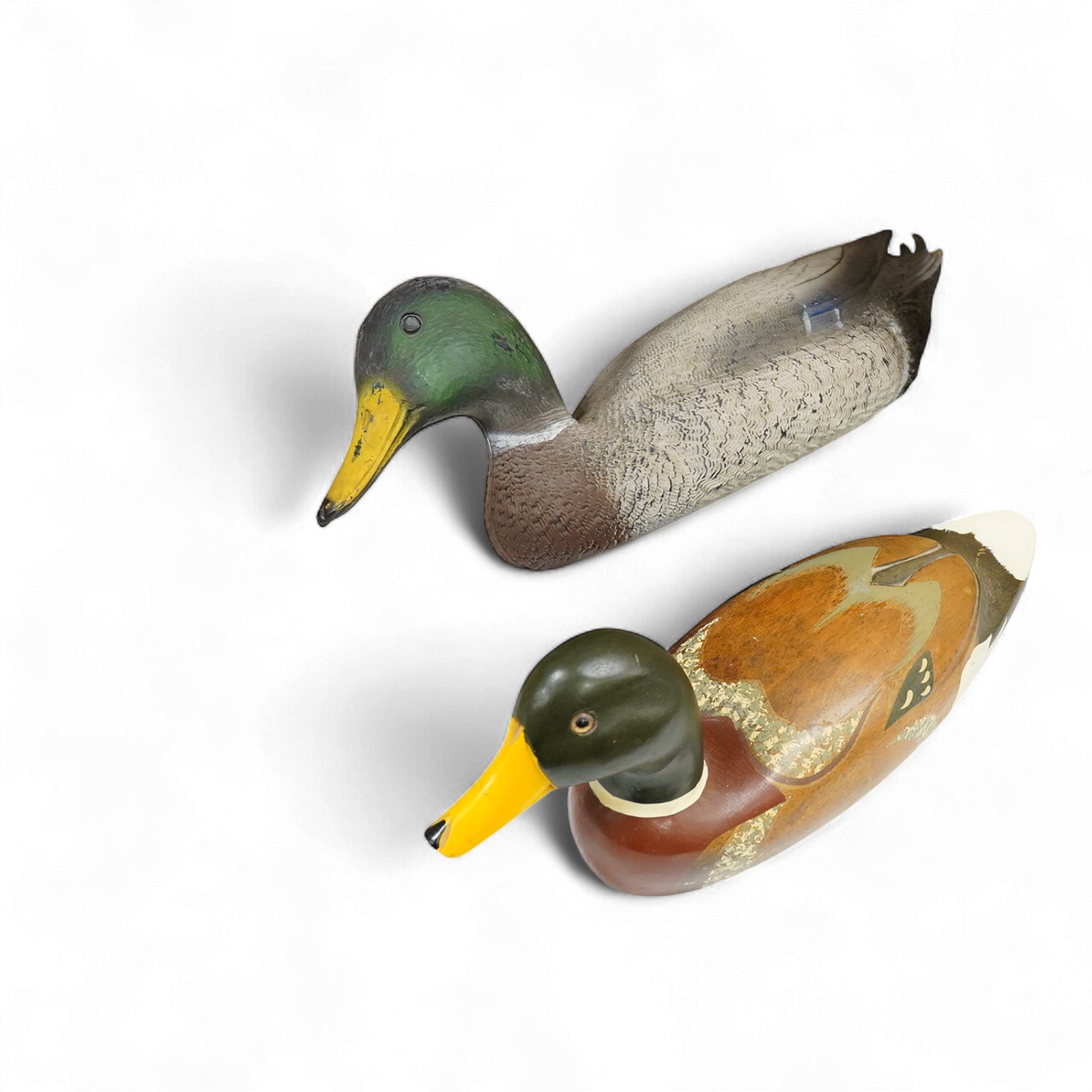 A decoy duck-42cm long, with a carved and painted wooden model of a duck. (2).